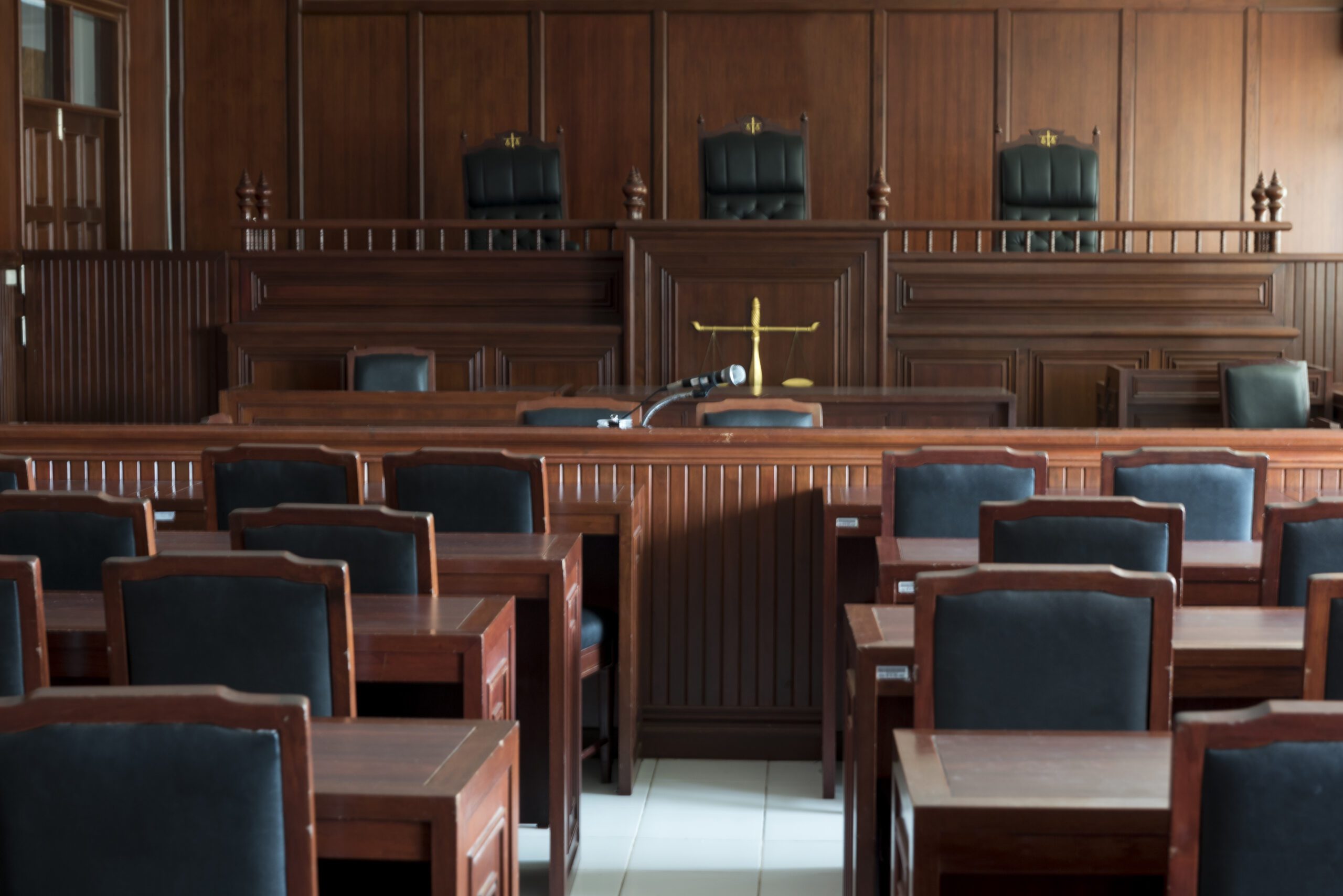 Empty Chairs And Tables In Courtroom Empty Chairs And Tables In Courtroom